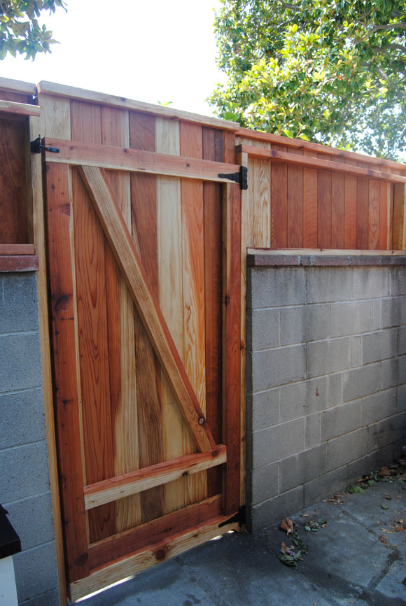 Raise the Height of Your Backyard Wall by Adding a Fence