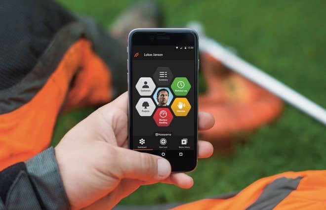 Husqvarna Fleet Services operator in the field with the new smartphone app