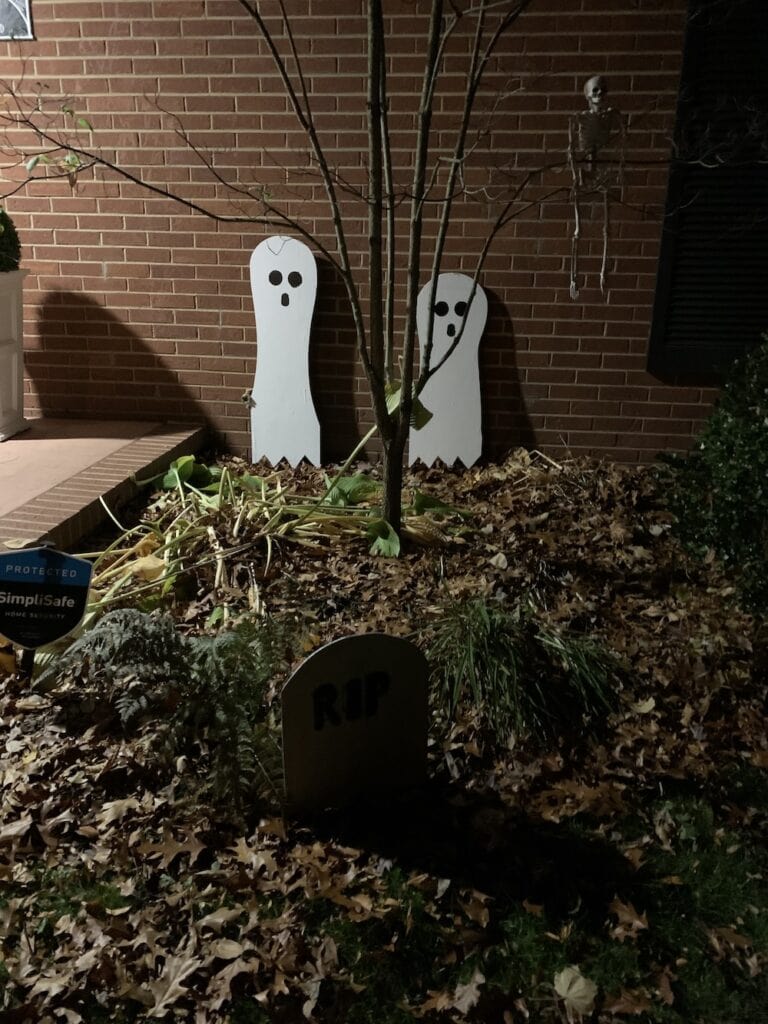9 Ghosts standing against our house