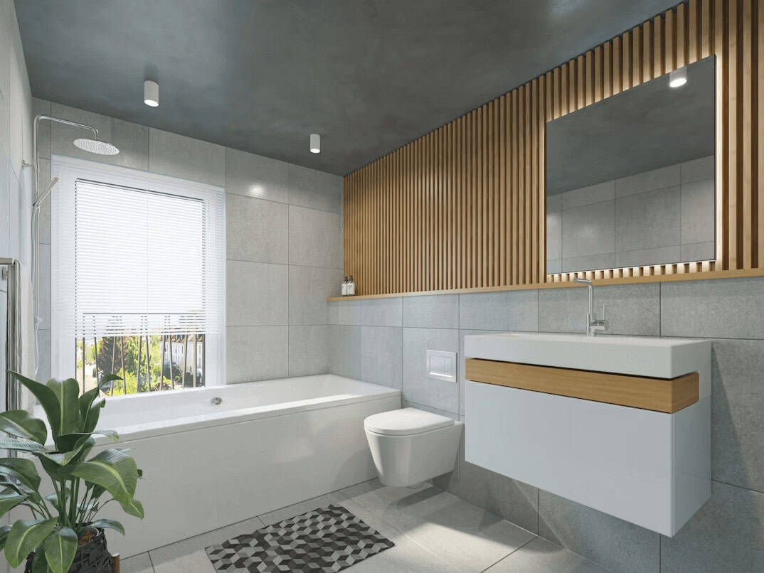 Modern bathroom with toilet, sink, and bathtub setup