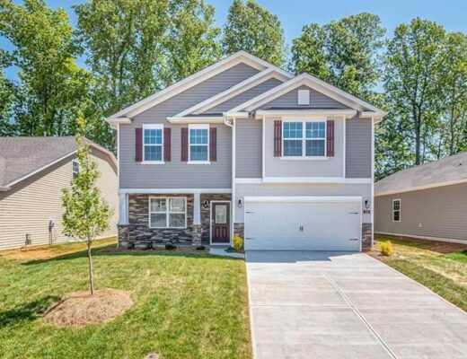 The Growing Focus on Exterior Simplicity in Modern Home Updates 12 a two story house with a driveway in front of it