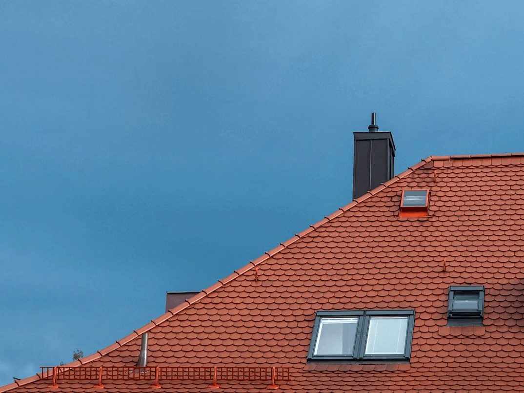 Clock on a red building, an