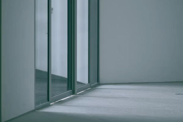 Empty room with glass doors, a common home security