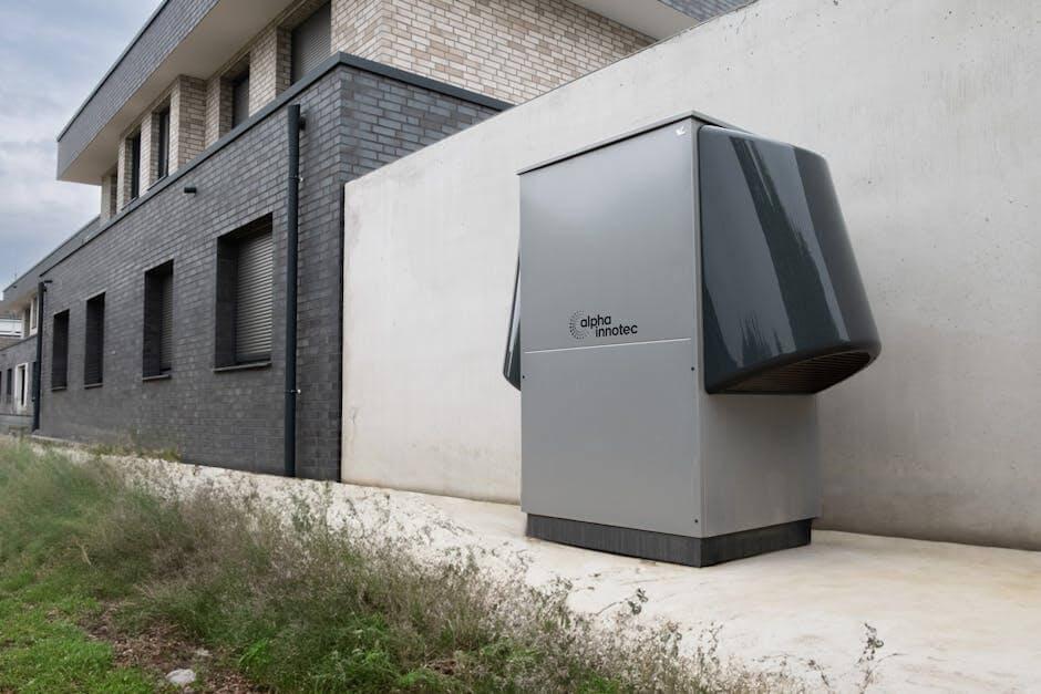 What Should You Know Before a Heat Pump Installation in 2026? 1 Gray refrigerator sitting outside a building