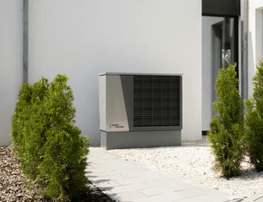 Outdoor heat pump unit on the side of a building