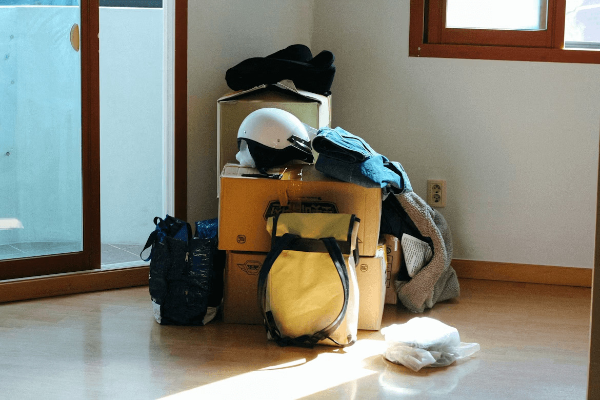 Packed luggage on hardwood floor ready for a long