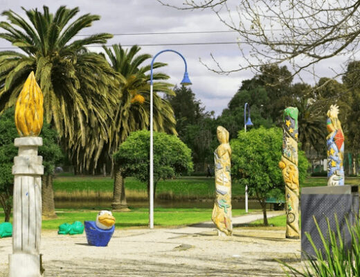 From Lawn to Playground: Preparing Your Yard for Safe Outdoor Play 125 Park with palm trees and sculptures in an outdoor play