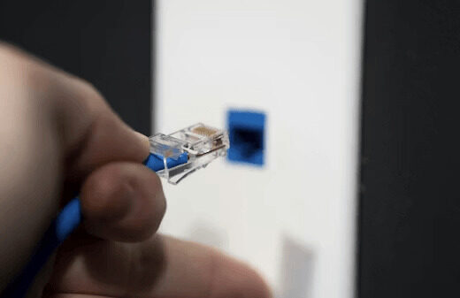 How To Run Ethernet Through Finished Walls Without Major Damage 5 Person holding electrical equipment for running ethernet
