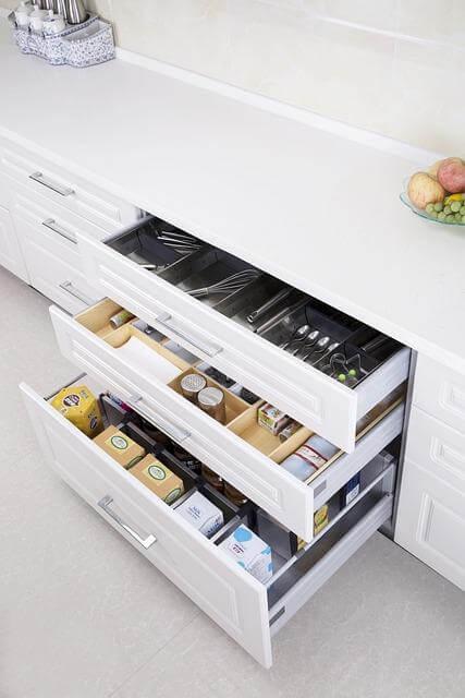 Three Key Ways to Create a Functional and Fresh Kitchen 2 A kitchen counter with a drawer full of organized food
