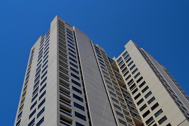 7 Property Management Brands Worth Knowing Before You Choose Your Rental Setup in 2026 2 Modern tall building with large windows, representing a