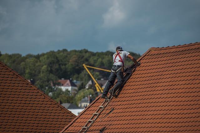 What to Do After Storm Damage Affects Your Roof 1 inspecting roof for storm damage