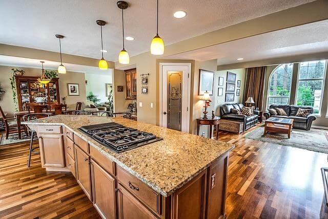 Why Regular Home Inspections Are Essential 2 A kitchen with a stove top oven being inspected