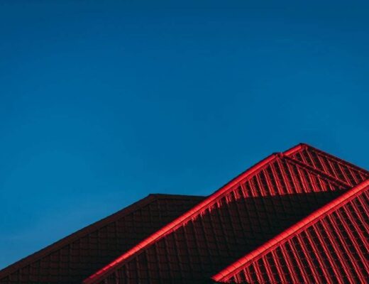 Building with a red light on top, illustrating