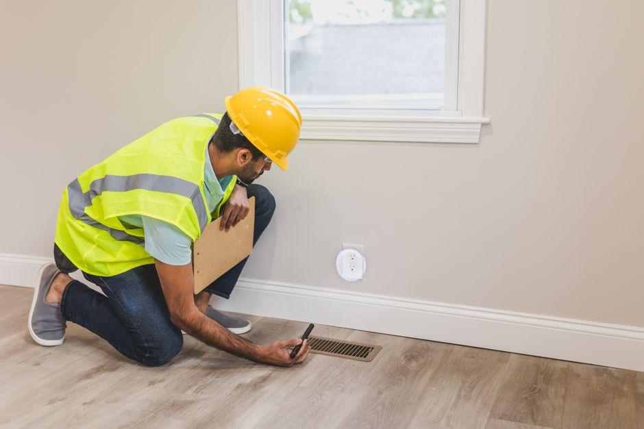 HVAC Maintenance service replacing an HVAC air filter