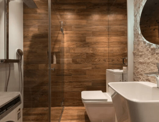 Modern bathroom with toilet, sink, and shower