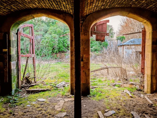 Old building with two open doors, ready
