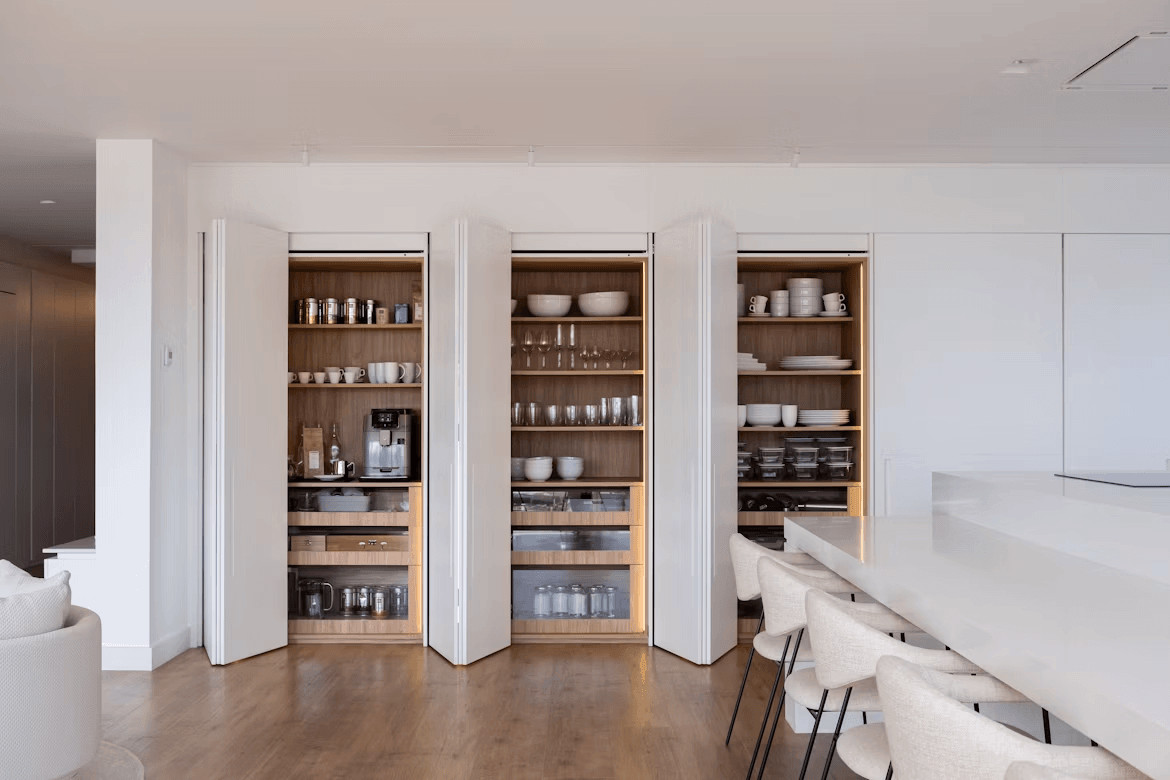The Away-Home Edit: How to Organize a House You Don’t Use Every Day 2 Organized kitchen with shelves filled with dishes