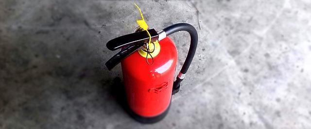 Why Regular Home Inspections Are Essential 3 Red fire extinguisher for home safety