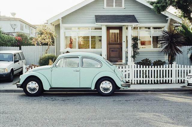 4 Questions Active Adults Ask Before Choosing the Right Neighborhood 3 Small blue car parked in front of a house
