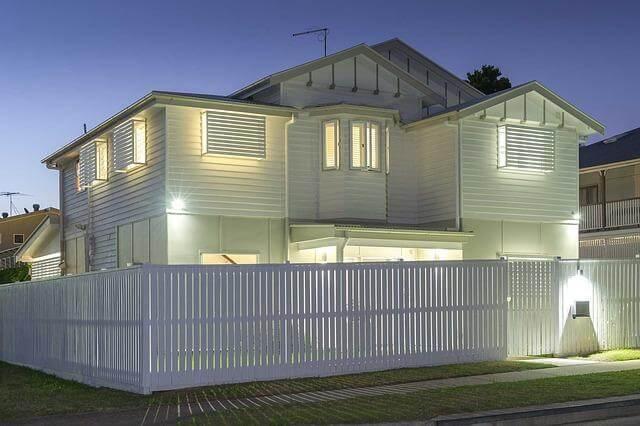 Remodeling for Real Life: Designing a Home That Still Works 10 Years Later 3 White house with a white fence at