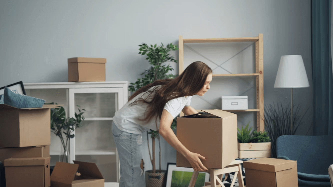 Woman moving boxes for a cross-country
