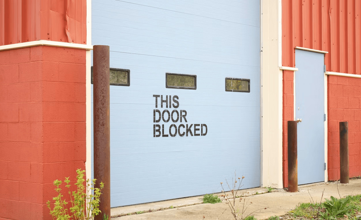 A blue and red industrial building with a