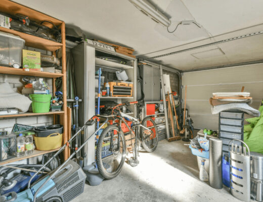 A cluttered garage workshop with various tools and items ready