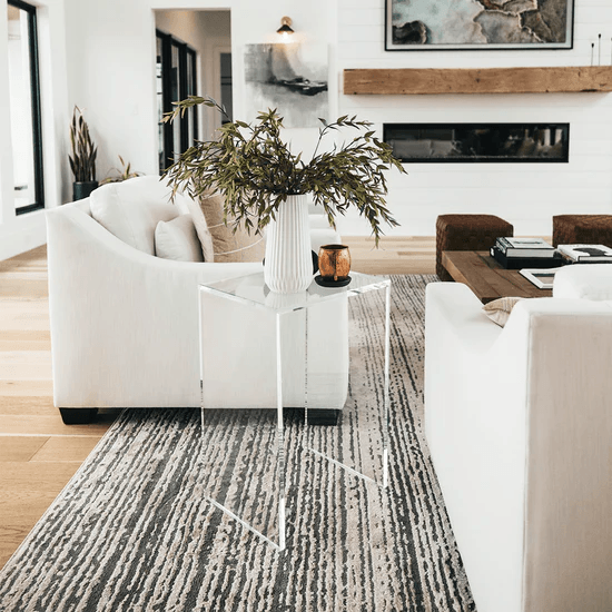 4 Reasons To Choose Acrylic Bedside Tables For Modern Bedrooms 1 A cozy living room with a fireplace and