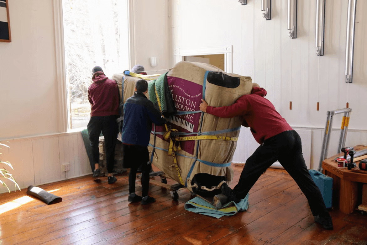 What Homeowners Should Know Before Hiring Movers 1 A group of movers standing around a