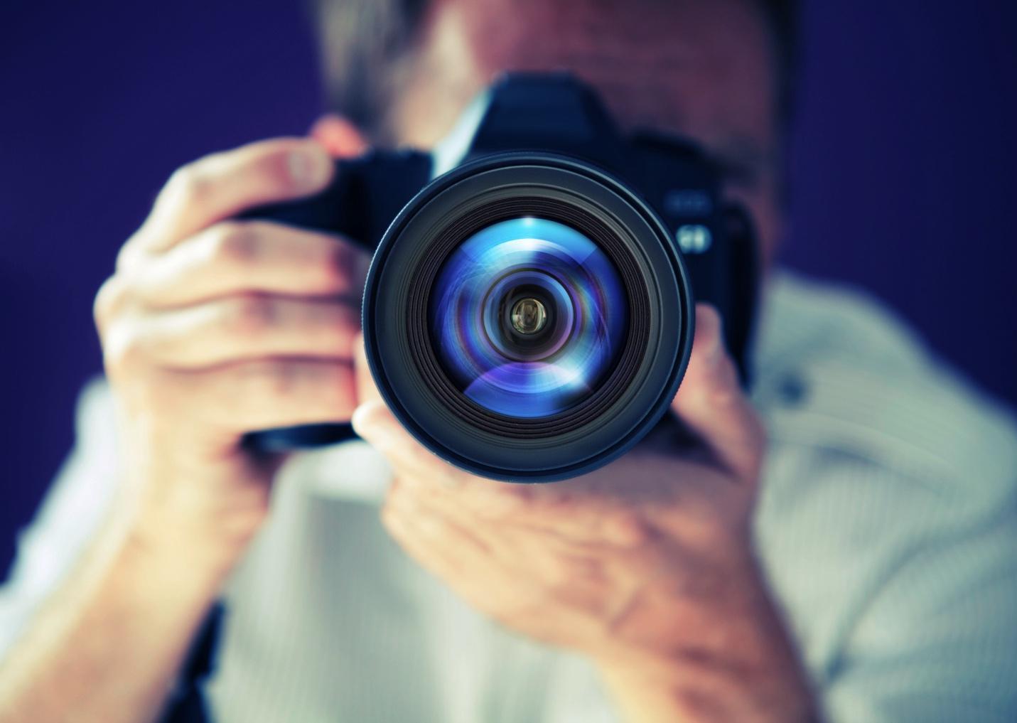 A Smart Visual Strategy For Selling Your Home: How Better Images Can Improve Your Return 1 A person with a camera