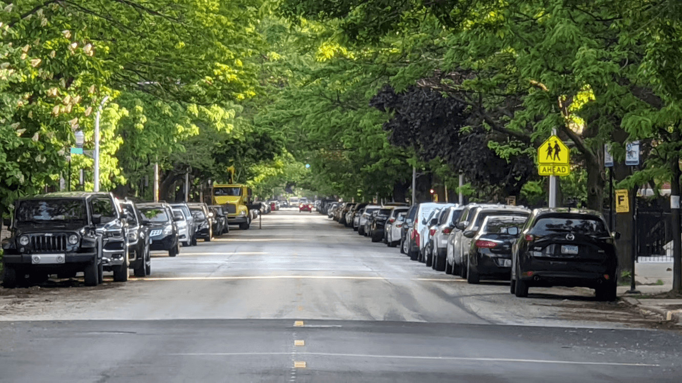 A row of cars parked on the side of