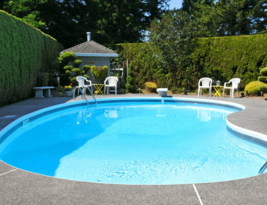 Pool Opening Made Simple: A Property Manager’s Approach Every Homeowner Can Use 69 Blue swimming pool with lounge chairs for a property