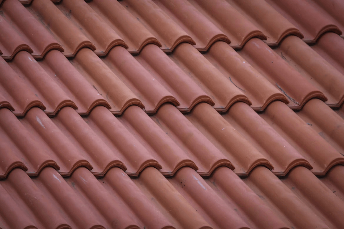Choosing the Right Roofing Material for Your Climate and Budget 2 Close-up of a red tile roof pattern