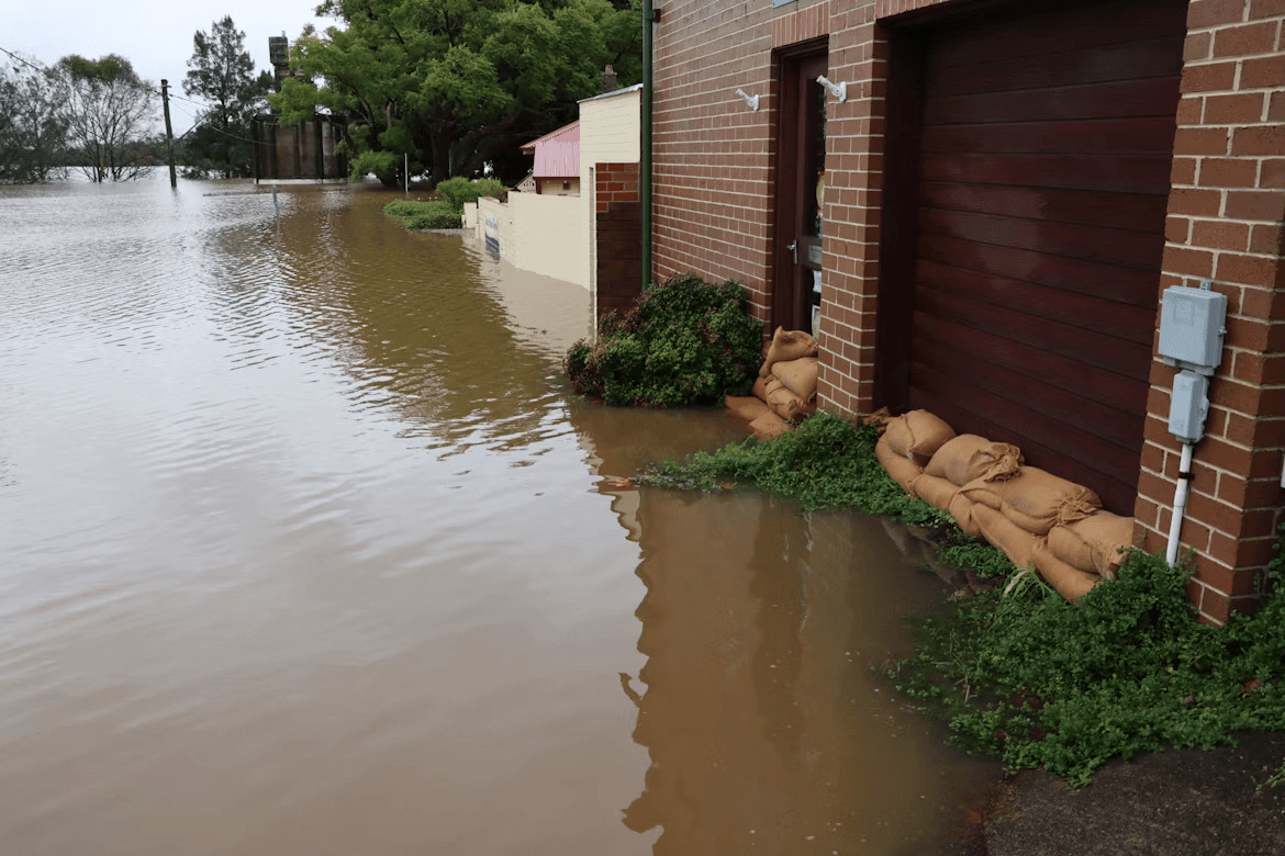 Top 5 Water Damage Restoration Companies in NYC 1 Flooded street next to a brick