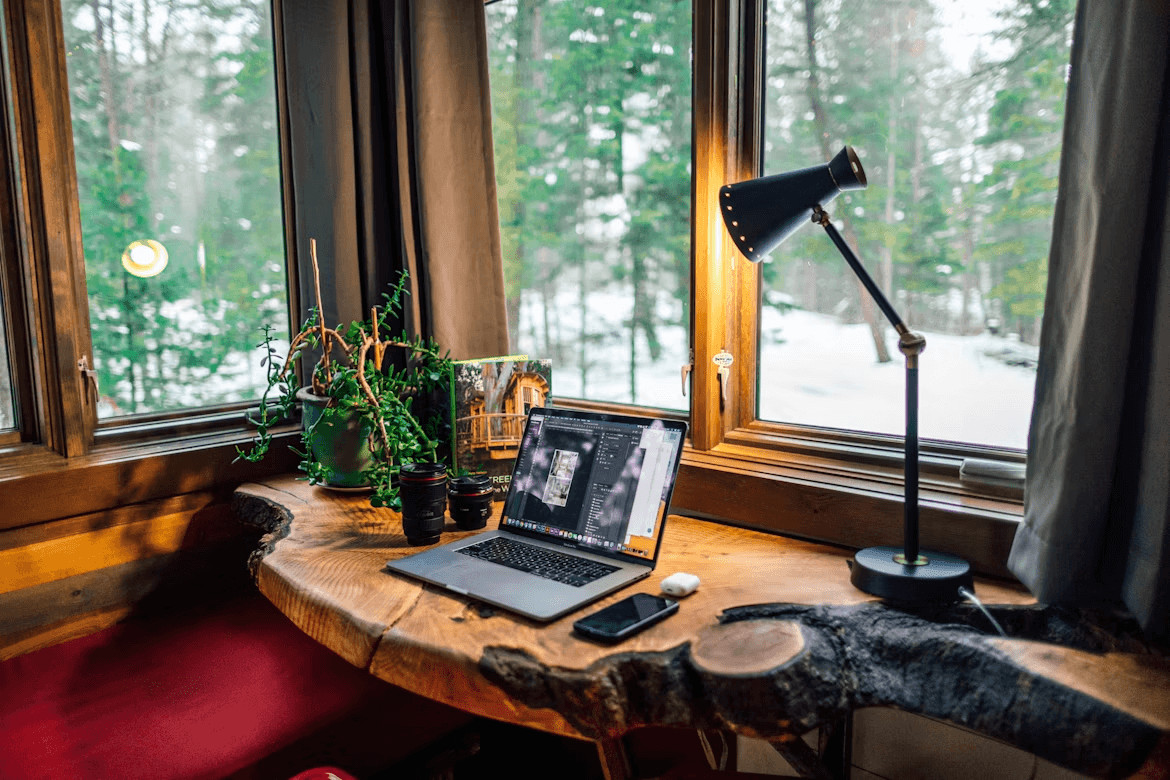 Laptop computer on a wooden desk for a comfortable home