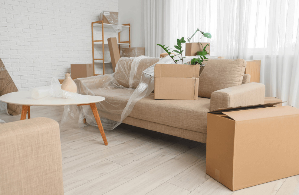 What It Really Costs to Move One Room's Worth of Furniture 1 room packed with boxes and furniture for a move