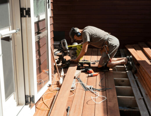 When a DIY Repair List Outgrows Your Skills and Budget 58 Man repairing wooden deck