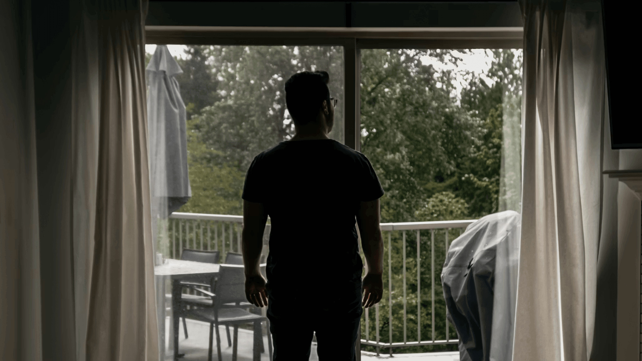 Man standing in front of a sliding