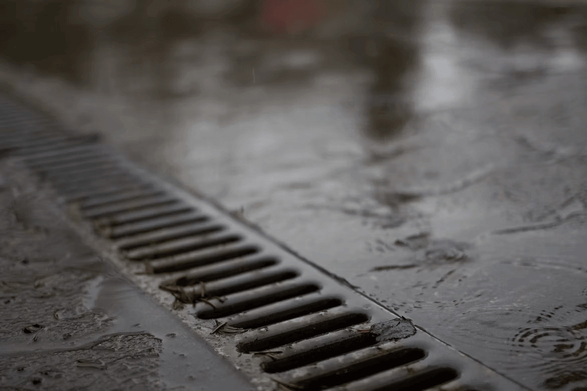 Manhole cover in a street, illustrating urban
