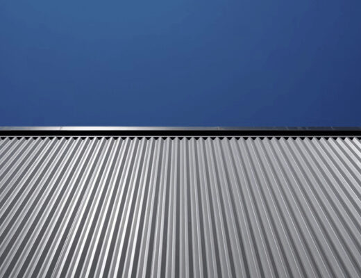 What Factors Influence the Lifespan of a Metal Roof 5 Metal roof under a blue sky