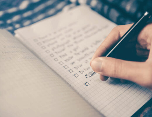Relocation Checklist: Handling Street Parking and Loading Zones Like a Pro 20 Person writing notes on a relocation checklist