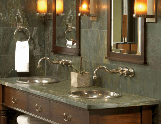Renovated bathroom with dual sinks, mirror