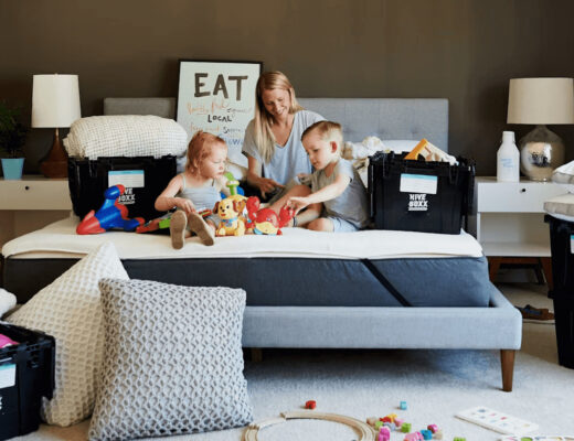 Moving With Kids: A Survival Plan for Moving Day and the First Week After 4 Woman and two children playing together on a bed