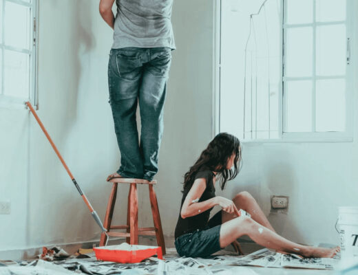 How to Film Your Home DIY Projects Like a Professional 30 Woman recording man on ladder during DIY project