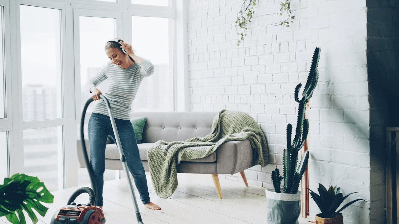 Why Regular Domestic Carpet Cleaning Is Essential for a Healthier Home 1 Woman vacuuming living room carpet for a healthier