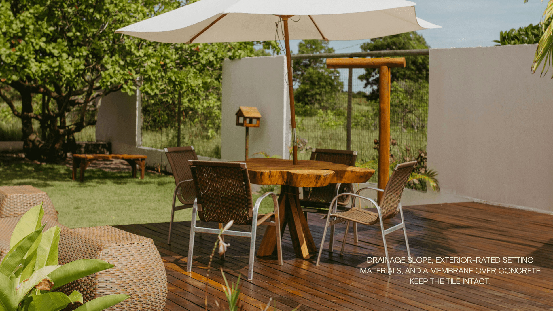 Wooden deck patio with table, chairs, and