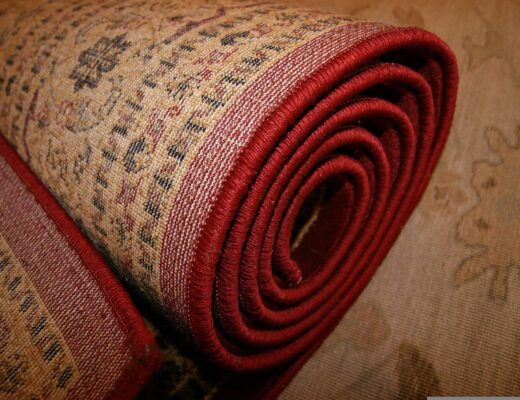 Close-up of a modern rolled rug displayed