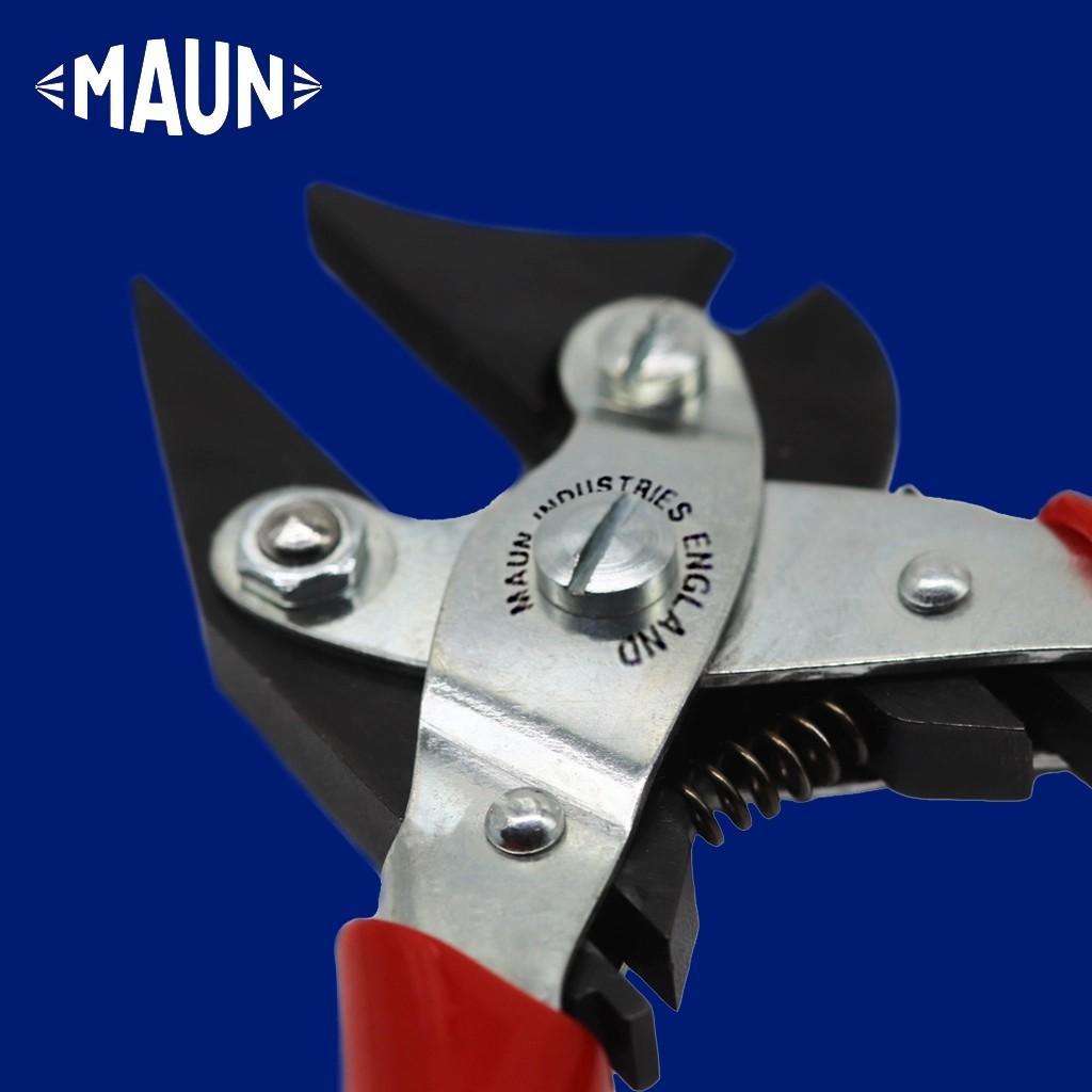 Close-up of parallel pliers on a blue