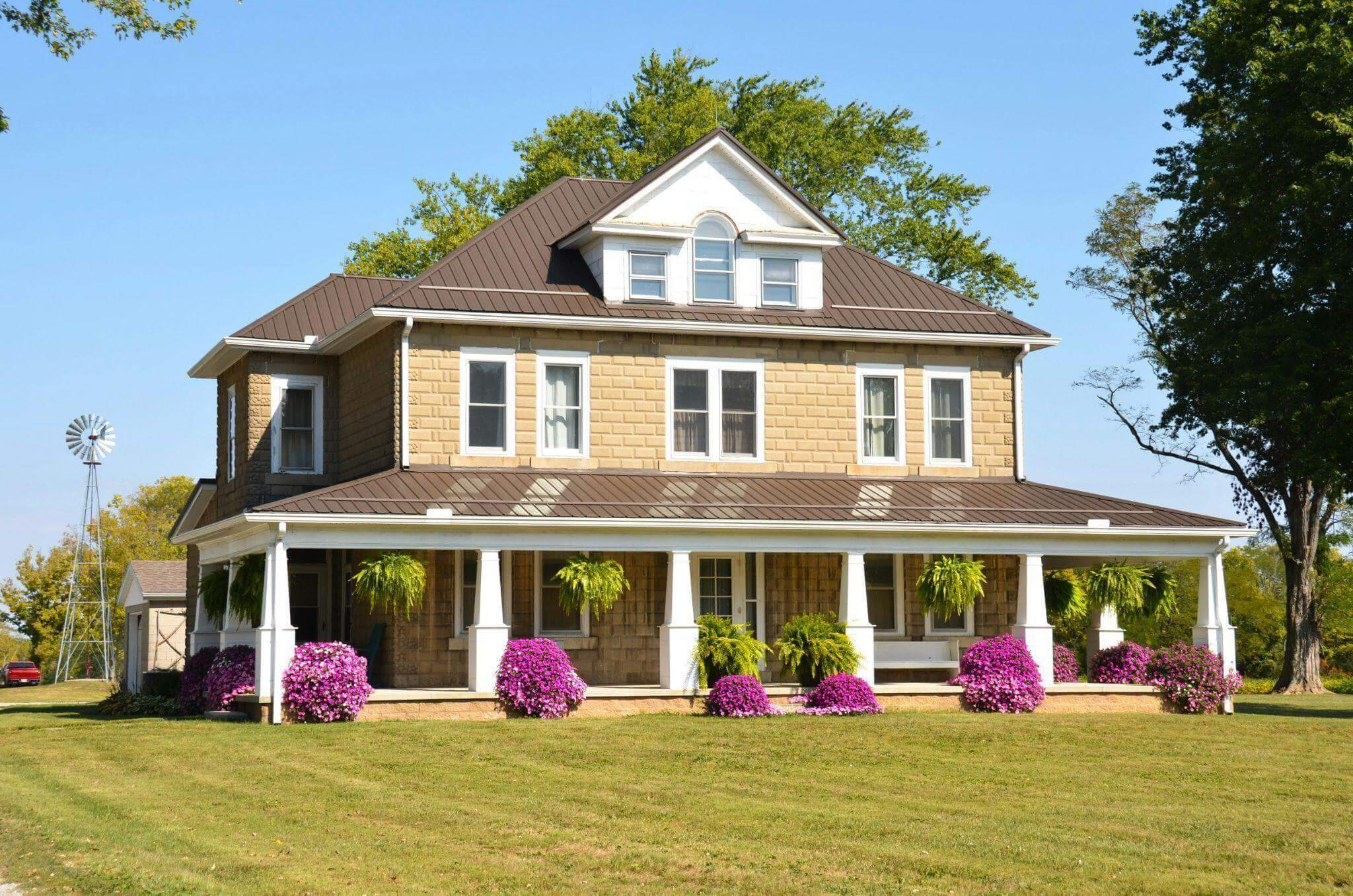 Large house with colorful flowers in the garden
