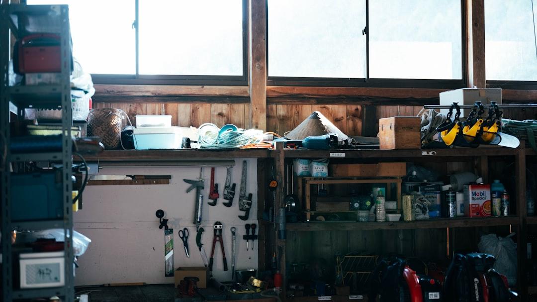 Organized home garage workshop with tools on a pegboard wall